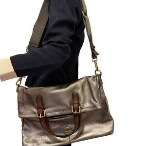 Fossil 
FOSSIL EXPLORER Foldover
Crossbody Messenger.. Shimmering Gold Tote Bag